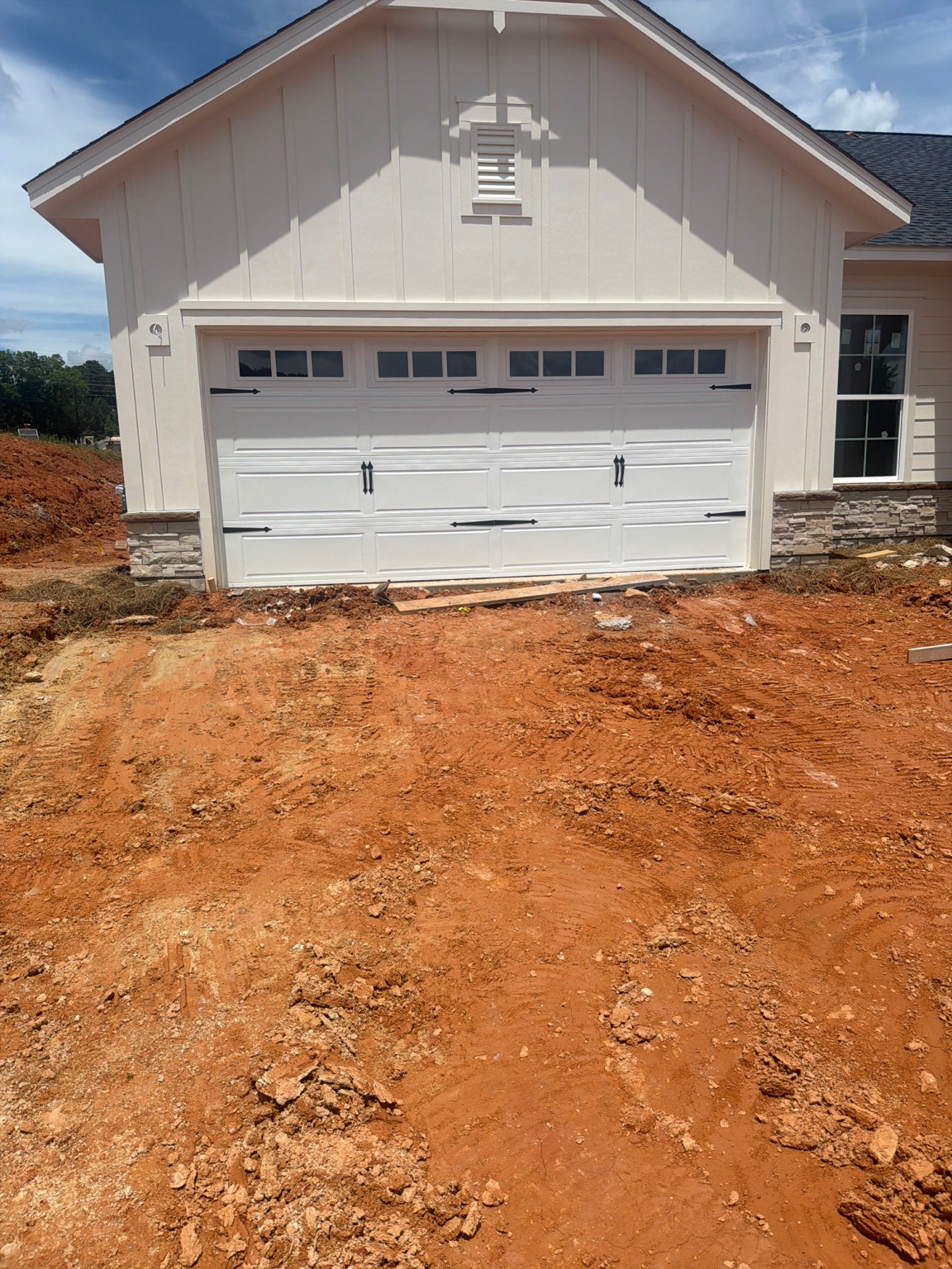 White double garage door installed on a new home