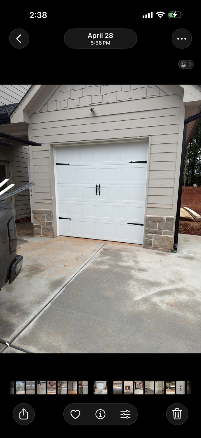 Single garage door with decorative hardware