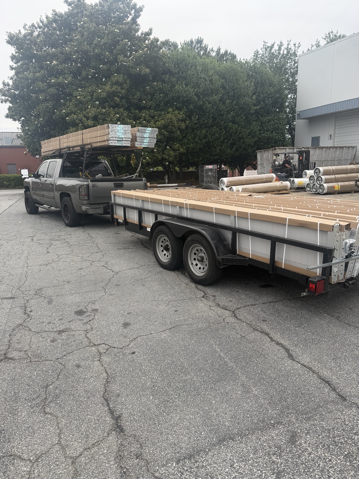 People's Garage Doors truck and trailer loaded with garage doors
